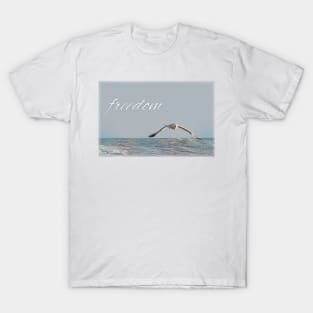 Freedom. Seagull flies over the sea T-Shirt